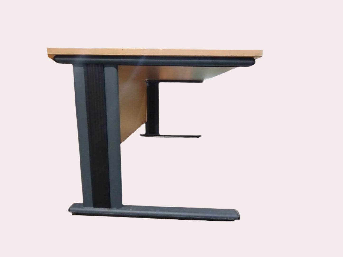 Wooden table with black metal base on a light gray background